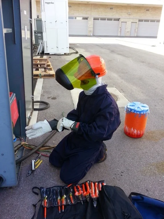 Electrician working on panels